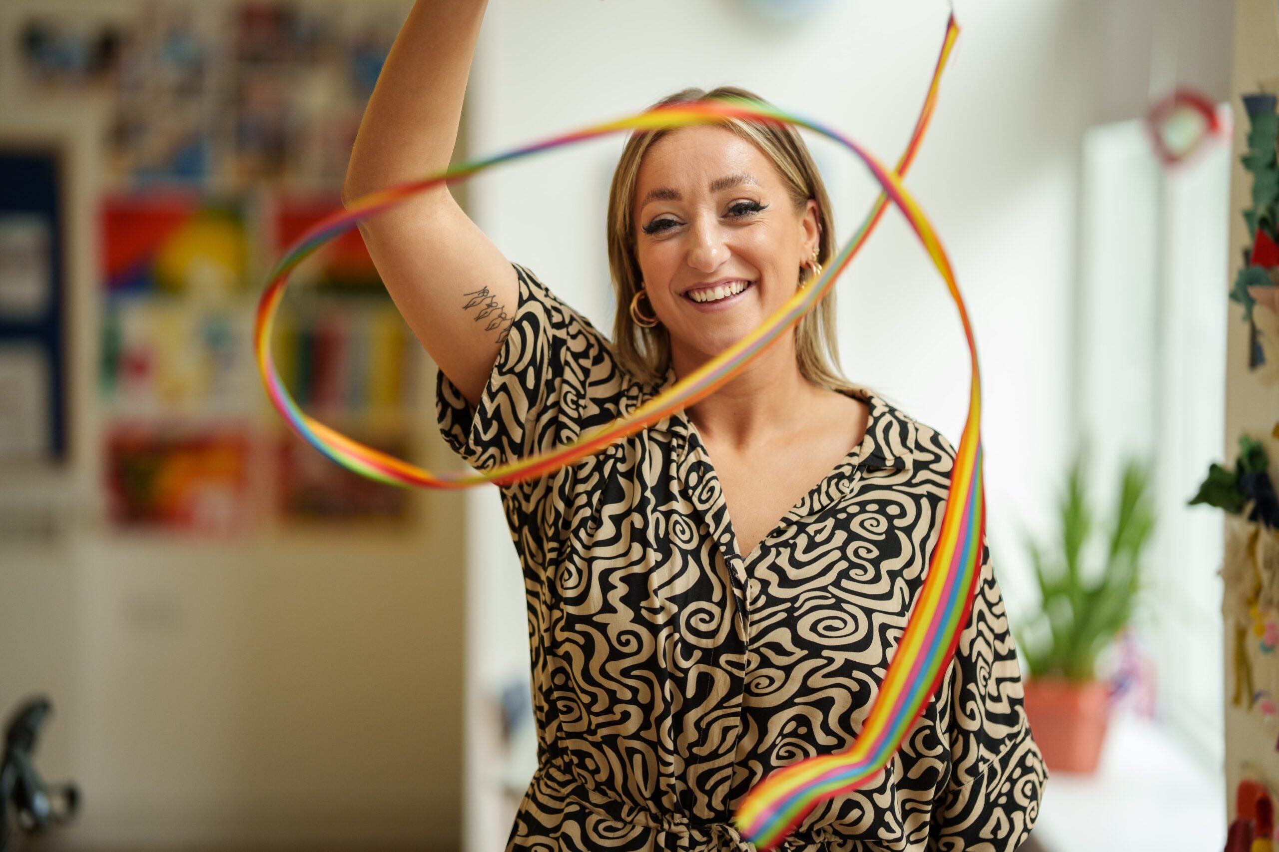 Look Ahead's Dance Movement Therapist Georgina twirling a ribbon used as part of her therapeutic dance activities.