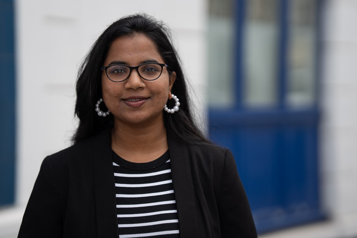 Look Ahead's Fundraising and Partnerships Manager Dipti dressed smartly and standing outside a service.